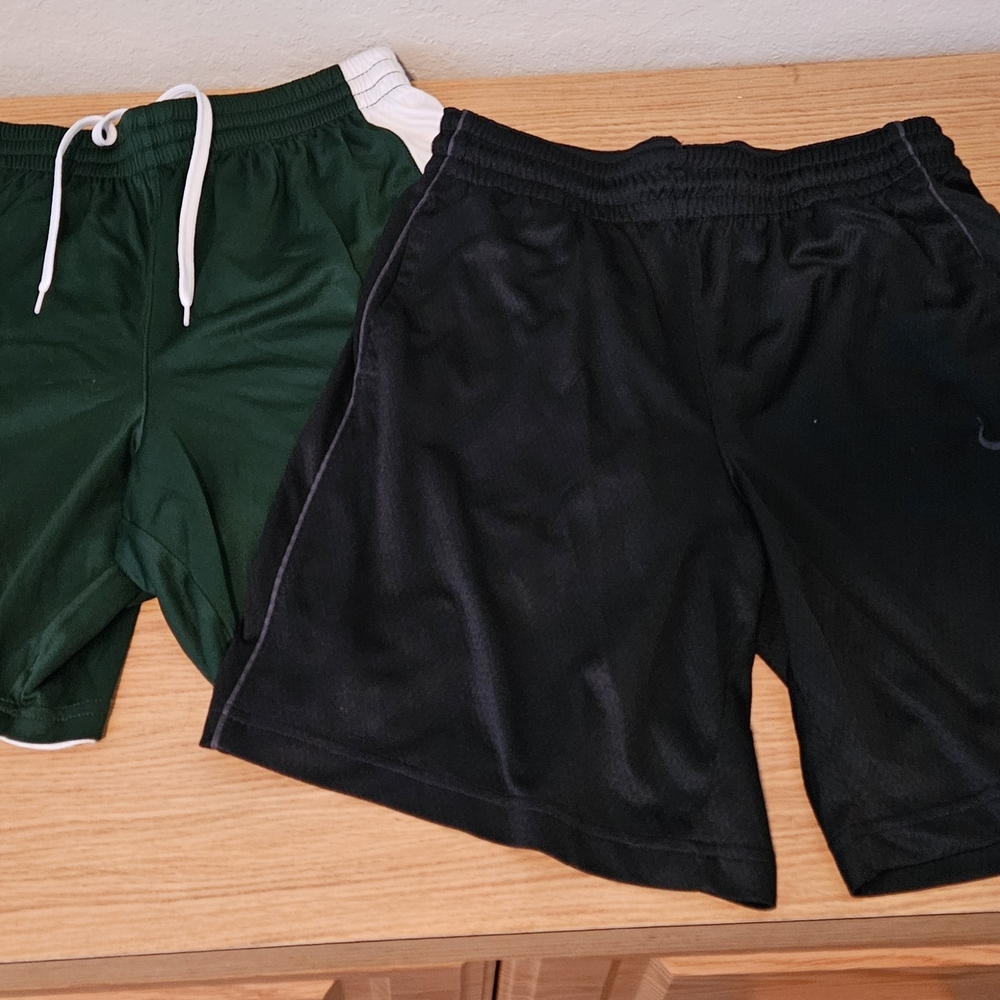 Two pairs of  men's athletic shorts. Nike, Under Armour. Medium.